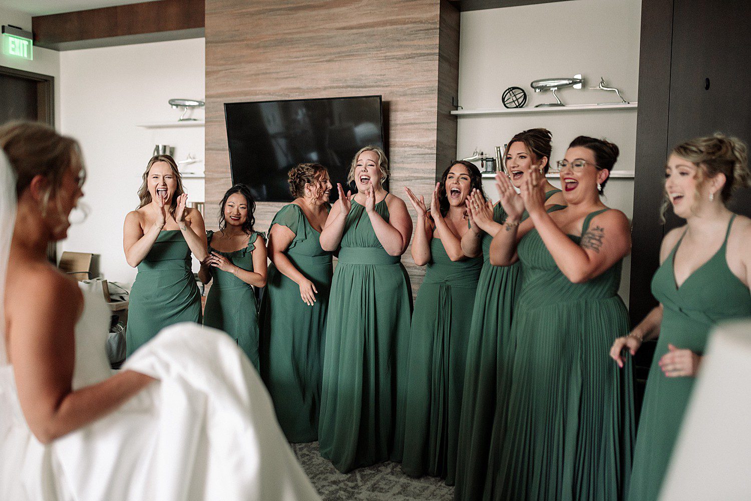 Tess and Grant's bridesmaids' first look at Tess at their Discovery World wedding in Milwaukee