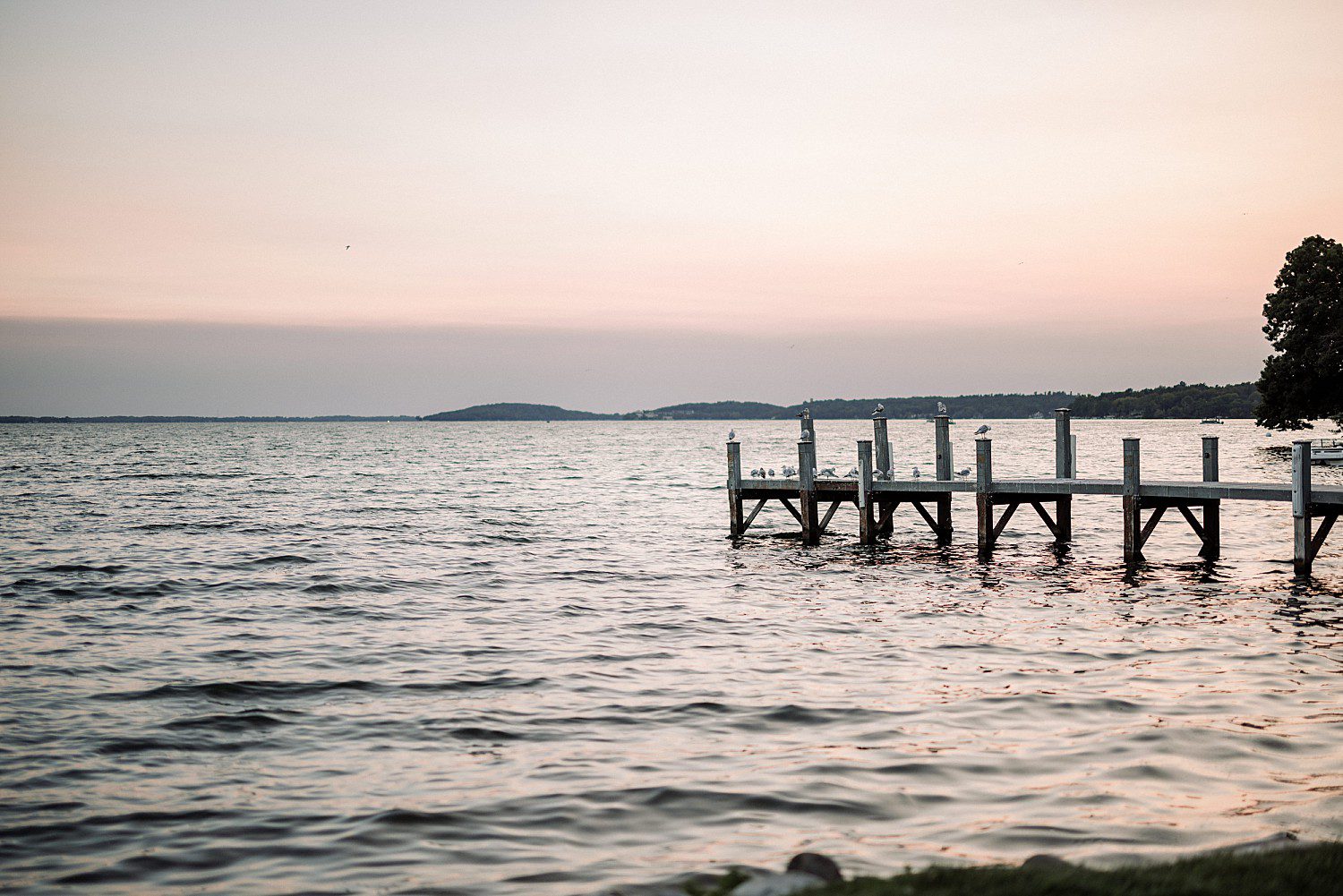 The pier on Green Lake at sunset the evening of Jenna and Josh's Heidel House wedding