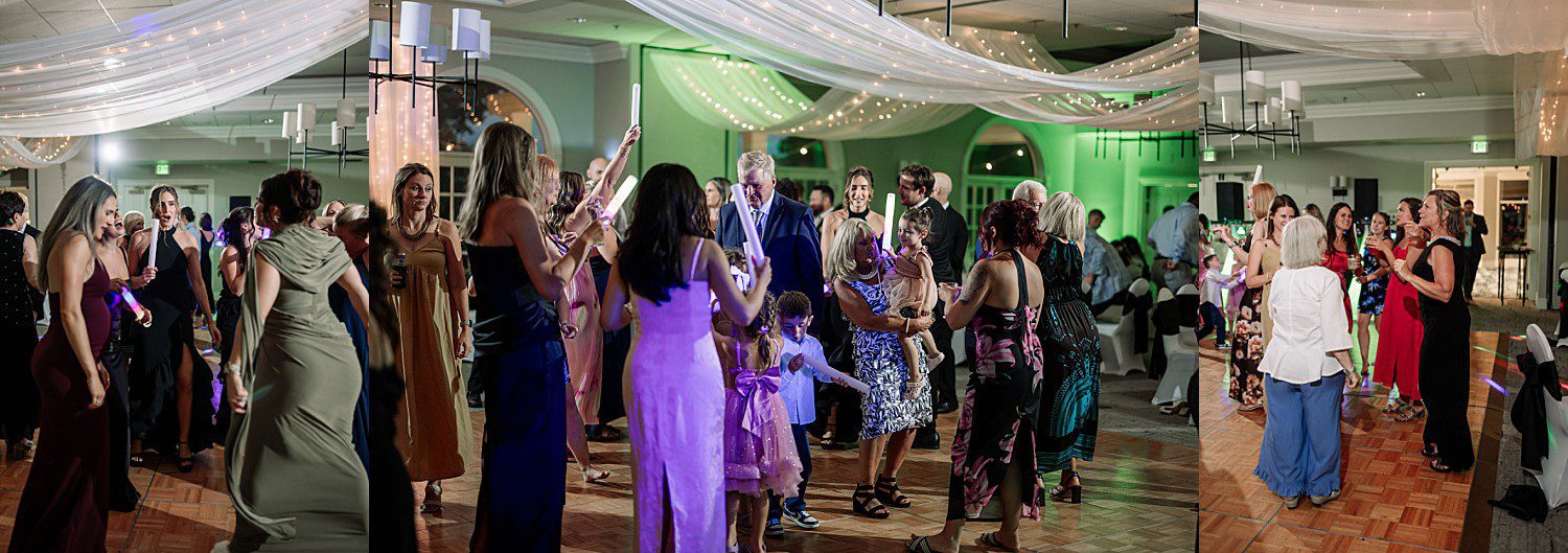 Guests dancing with glow sticks during open dancing at Jenna and Josh's Heidel House wedding reception