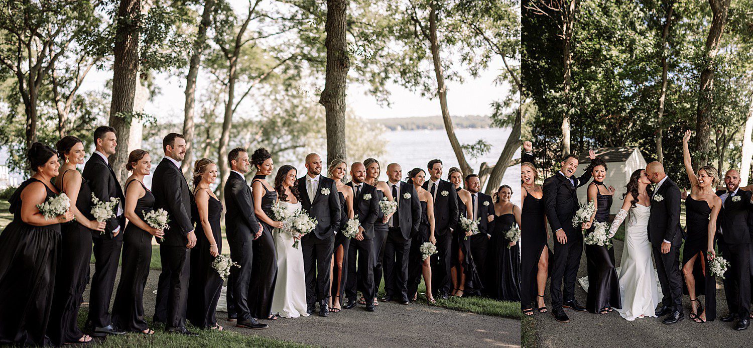 Jenna and Josh walking together by the water with their wedding party at the Heidel House