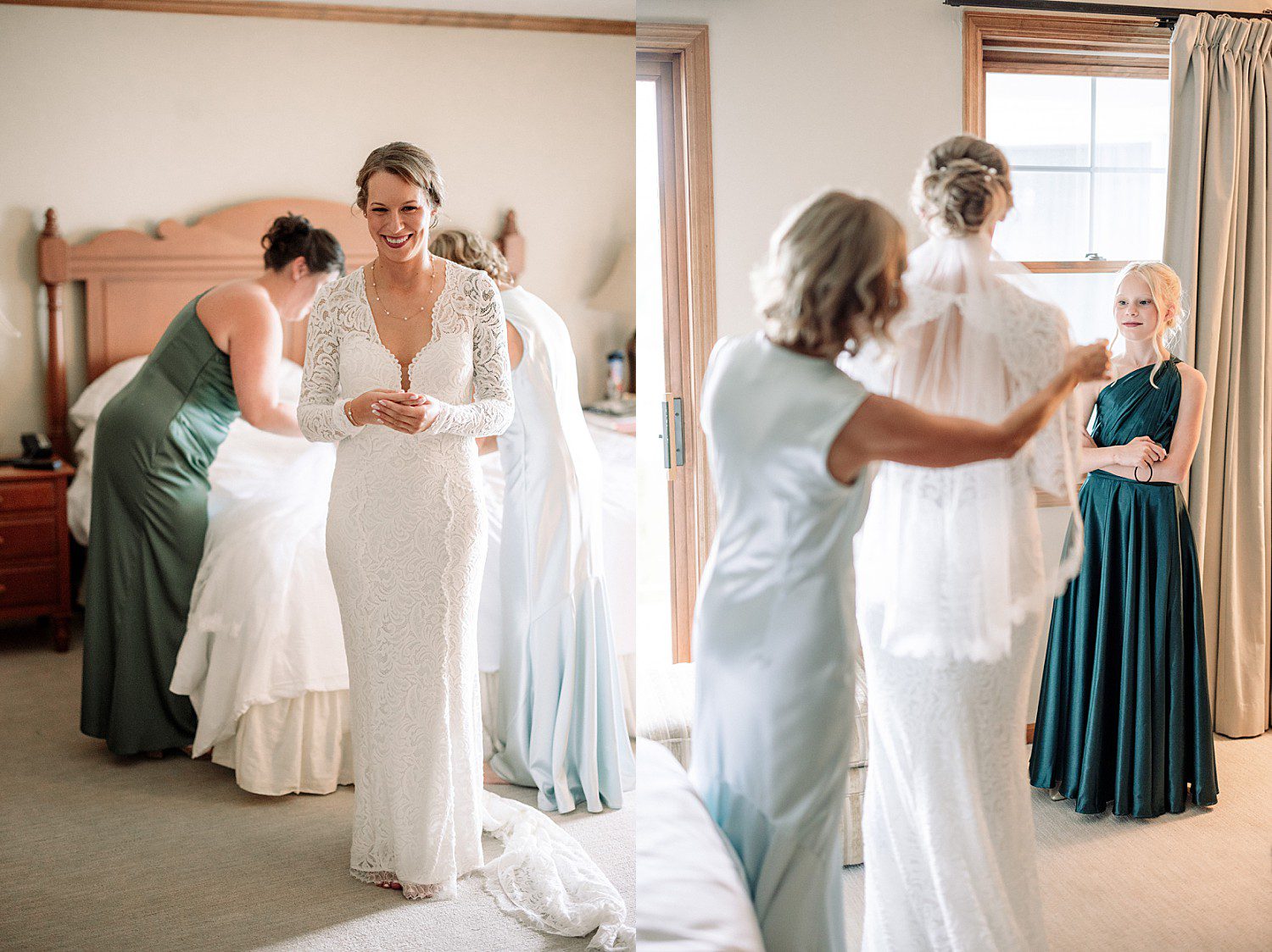 Kathryn with her mom and bridesmaids in green dresses finishing getting ready at The Osthoff Resort in Elkhart Lake, Wisconsin