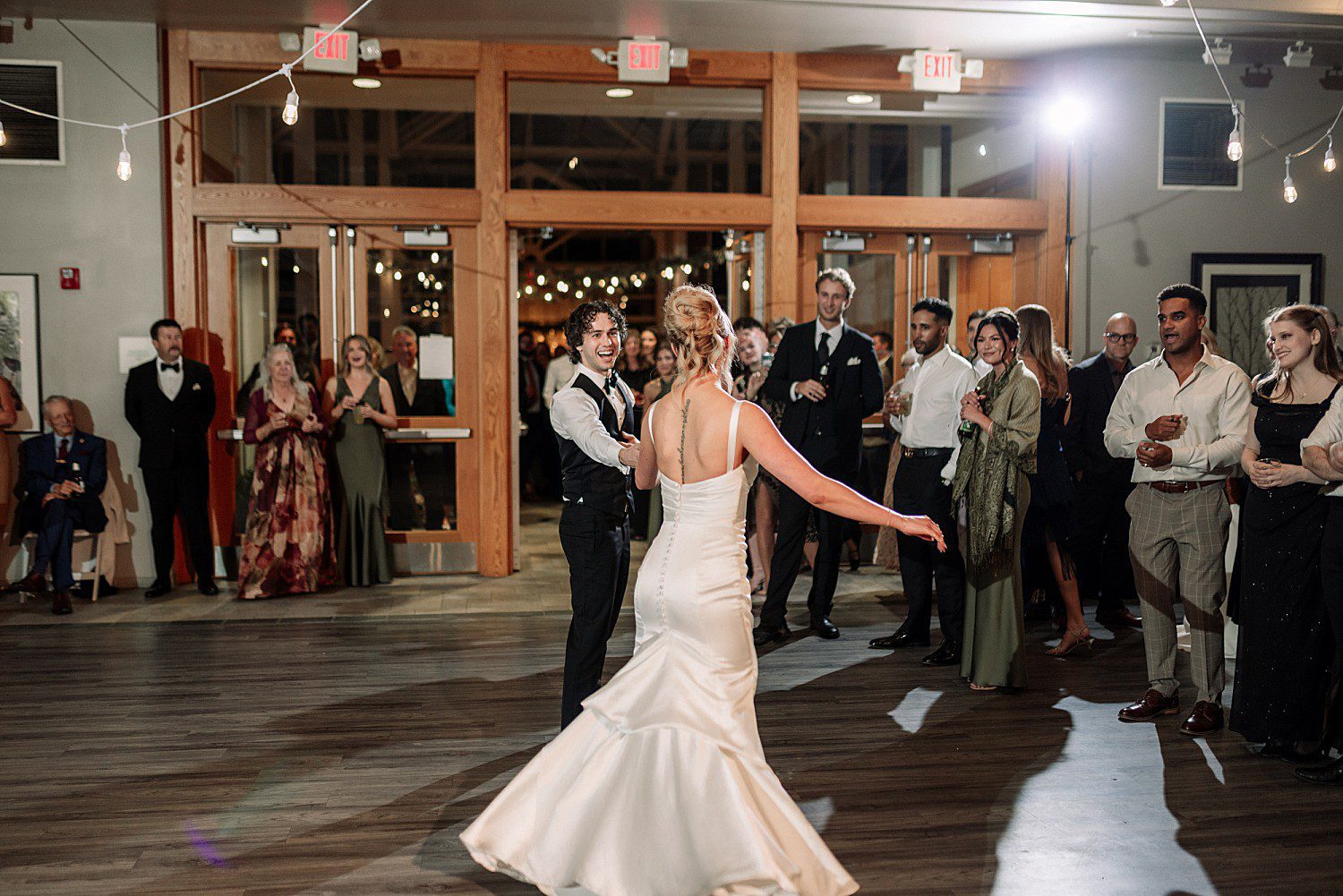 Guests circling Noelle and Noah during their first dance at Boerner Botanical Gardens in Hales Corners, Wisconsin