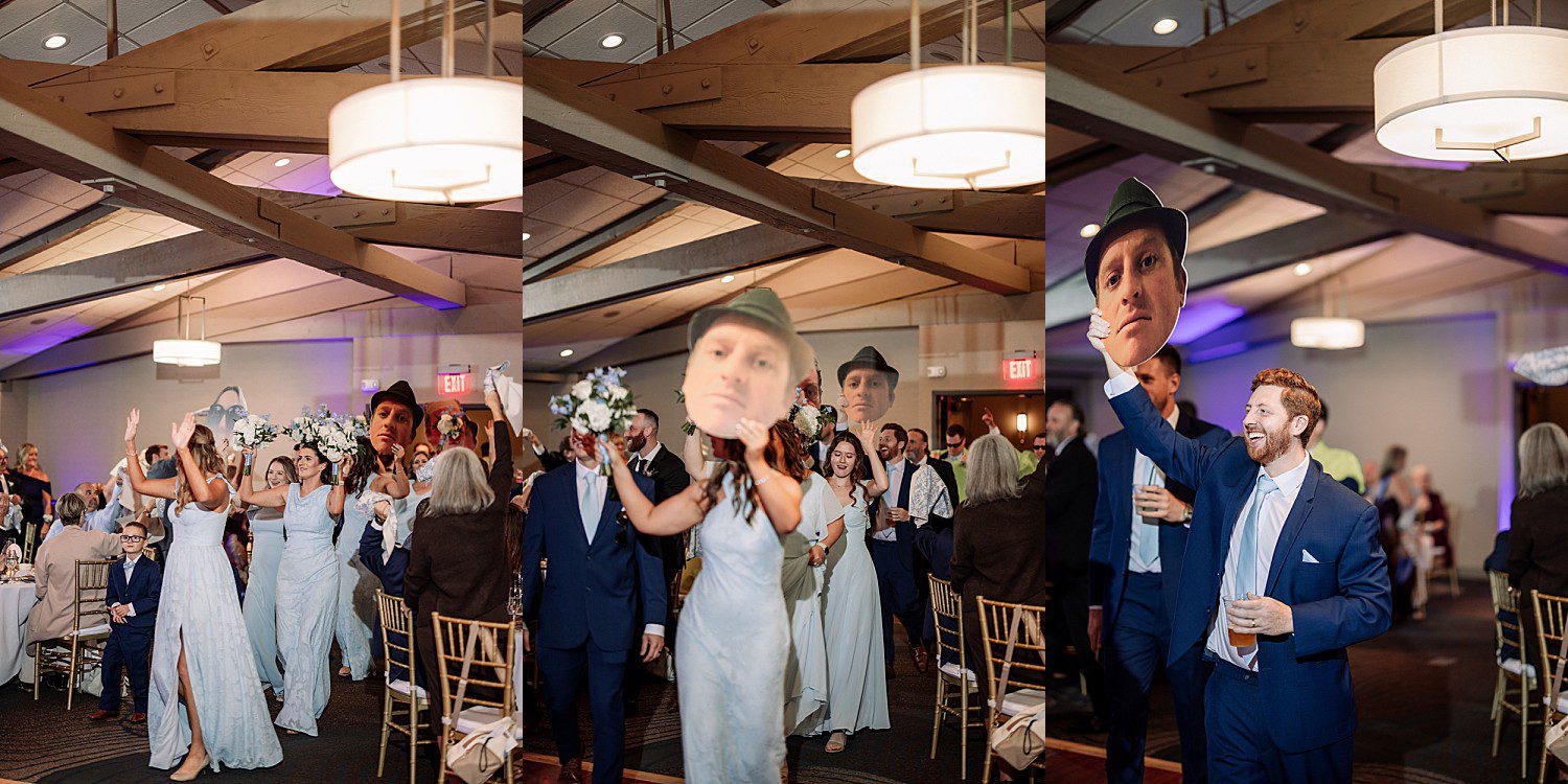 lakeside Wisconsin wedding in Delavan, Wisconsin: wedding guests raising glasses and a reception speaker holding a microphone.